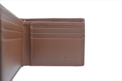 Brown leather wallet with 'Fossil' branding on a white background
